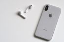 silver iphone x with airpods
