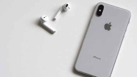 silver iphone x with airpods