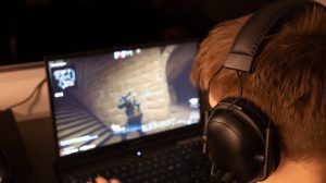 black headphones on black laptop computer